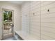 Mudroom with built-in bench, hooks, storage, and access to the backyard at 490 Mount Paran Rd, Atlanta, GA 30327