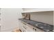 Pantry countertop featuring drawers, cabinets and gray stone at 490 Mount Paran Rd, Atlanta, GA 30327