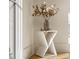 Side table with vase and flowers; light wood floors at 490 Mount Paran Rd, Atlanta, GA 30327