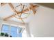 Stylish ceiling featuring exposed wood beams and a modern chandelier at 490 Mount Paran Rd, Atlanta, GA 30327