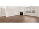 Bright living room featuring a fireplace and hardwood floors at 628 Kimberwick Dr, Locust Grove, GA 30248