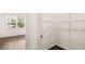 Walk-in closet features wire shelving and hardwood floors at 628 Kimberwick Dr, Locust Grove, GA 30248