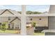 Residential neighborhood visible through window blinds at 628 Kimberwick Dr, Locust Grove, GA 30248