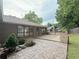 Beautiful backyard featuring a stained concrete patio, wooden deck and lush landscaping at 1341 Beeblossom Trl, Lawrenceville, GA 30044