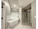 Modern bathroom featuring a soaking tub, glass-enclosed shower, and sleek fixtures at 1341 Beeblossom Trl, Lawrenceville, GA 30044