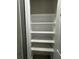 White linen closet with shelving at 1341 Beeblossom Trl, Lawrenceville, GA 30044