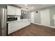Bright kitchen showcases white cabinetry, sleek countertops, and modern stainless steel refrigerator at 1341 Beeblossom Trl, Lawrenceville, GA 30044