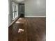 Inviting living area with hardwood floors and sunlit windows at 1341 Beeblossom Trl, Lawrenceville, GA 30044