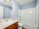 Cozy bathroom with a single sink vanity and a combined shower and tub at 4670 Ernest Dr, Forest Park, GA 30297