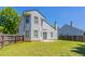 Back exterior of two-story home with fenced backyard and patio area at 4915 Truitt Ln, Decatur, GA 30035