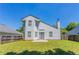 Two-story home with patio and sliding glass doors leading to backyard at 4915 Truitt Ln, Decatur, GA 30035