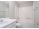 Neutral bathroom featuring tub/shower combo and single sink vanity at 4915 Truitt Ln, Decatur, GA 30035