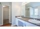 Primary bath boasts dual sinks, granite counters, and walk in closet at 4915 Truitt Ln, Decatur, GA 30035