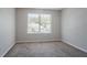 Neutral bedroom featuring carpet flooring and a window with blinds at 4915 Truitt Ln, Decatur, GA 30035