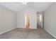 Neutral bedroom features vaulted ceiling, neutral carpet and a closet at 4915 Truitt Ln, Decatur, GA 30035