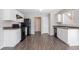 Kitchen featuring bright cabinets, modern appliances, wood floors, and ample counter space at 4915 Truitt Ln, Decatur, GA 30035