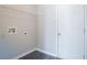 Functional laundry room with durable flooring, utility connections, and a storage shelf for added convenience at 4915 Truitt Ln, Decatur, GA 30035