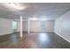 Spacious basement with laminate floors, neutral paint colors, recessed lighting, and exterior access at 1076 Plantation Se Blvd, Conyers, GA 30094