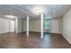 Finished basement features laminate flooring, multiple storage closets, access to exterior at 1076 Plantation Se Blvd, Conyers, GA 30094