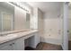 Bathroom featuring double sinks, vanity, tub/shower, and natural light at 1076 Plantation Se Blvd, Conyers, GA 30094