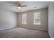 Neutral bedroom with carpeting and two windows with blinds at 1076 Plantation Se Blvd, Conyers, GA 30094