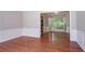 Bright dining room features elegant wainscoting and seamless flow to the adjoining kitchen area at 1076 Plantation Se Blvd, Conyers, GA 30094
