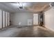Spacious garage with concrete floor and water heater, offering ample storage and utility space at 1076 Plantation Se Blvd, Conyers, GA 30094