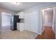 Bright eat-in kitchen with white cabinets, tile flooring, and seamless entry to other rooms at 1076 Plantation Se Blvd, Conyers, GA 30094