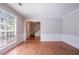 Inviting living room with fresh paint, wainscoting, and great natural light from the picture window at 1076 Plantation Se Blvd, Conyers, GA 30094