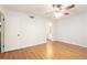 This bedroom features wood floors, ceiling fan, and access to a bathroom, enhancing the property's appeal at 205 Tuxworth Cir # 205, Decatur, GA 30033