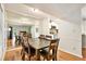 Dining room with a large mirror reflecting a dining table and a glimpse into the adjacent kitchen at 205 Tuxworth Cir # 205, Decatur, GA 30033