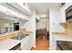 Bright kitchen with white cabinetry, stainless steel appliances, and an open view to the dining and living areas at 205 Tuxworth Cir # 205, Decatur, GA 30033