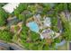 Beautiful aerial view of community amenities featuring a pool, clubhouse, and landscaped grounds at 4625 Cold Spring Court, Cumming, GA 30041