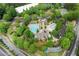 Overhead view of neighborhood clubhouse featuring swimming pool, landscaping and water feature at 4625 Cold Spring Court, Cumming, GA 30041