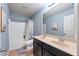Bathroom with shower and tub, double sink vanity and soft blue walls at 4625 Cold Spring Court, Cumming, GA 30041