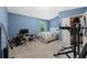 Carpeted bedroom with a window, closet, and exercise equipment at 4625 Cold Spring Court, Cumming, GA 30041