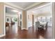 Open floorplan views living room, foyer and the dining room with natural light and crown molding at 4625 Cold Spring Court, Cumming, GA 30041
