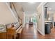Inviting foyer with hardwood floors, staircase, and views of living room and kitchen at 4625 Cold Spring Court, Cumming, GA 30041