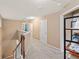 Upstairs hallway with multiple doors and carpet flooring at 4625 Cold Spring Court, Cumming, GA 30041