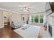 Bright living room featuring a fireplace, hardwood floors, and a large window at 4625 Cold Spring Court, Cumming, GA 30041