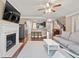 Open concept living room showcases a fireplace and access to the kitchen at 4625 Cold Spring Court, Cumming, GA 30041