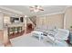 Open-concept living room with a fireplace, kitchen view, and a cozy seating area at 4625 Cold Spring Court, Cumming, GA 30041