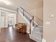 Staircase with carpeted steps and adjacent piano at 4625 Cold Spring Court, Cumming, GA 30041