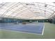 Spacious indoor tennis court with excellent lighting and professional-grade playing surface at 4625 Cold Spring Court, Cumming, GA 30041