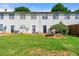 Spacious backyard with green lawn, wooden fence, and back of a two-story white house at 2465 Brianna Dr, Hampton, GA 30228
