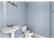 Powder bathroom featuring a pedestal sink and toilet at 2465 Brianna Dr, Hampton, GA 30228