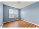 Bedroom with plenty of natural light and laminate wood flooring at 2465 Brianna Dr, Hampton, GA 30228