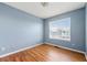 Cozy bedroom with laminate wood flooring and a window at 2465 Brianna Dr, Hampton, GA 30228