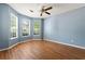 Bedroom with ample light from a bay of windows and wood floors at 2465 Brianna Dr, Hampton, GA 30228