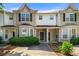 Charming townhome featuring a well-manicured front yard and inviting entrance at 2465 Brianna Dr, Hampton, GA 30228